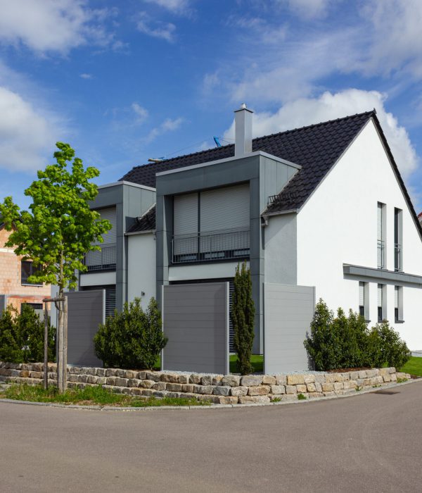 modern house facade with white and grey colors in germany spring countryside